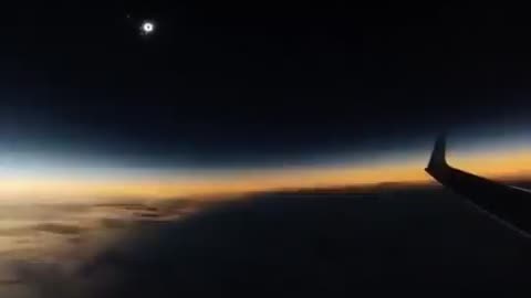 Solar eclipse seen from an airplane in mid-flight