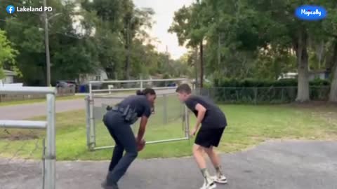 Female police officer schools local teen in game of one on one basketball