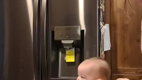 Dog Startles Baby into Spilling Water