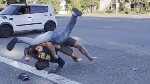 WHITE MAN FIGHTS WITH BLACK MAN AND NEARLY BREAKS HIS NECK