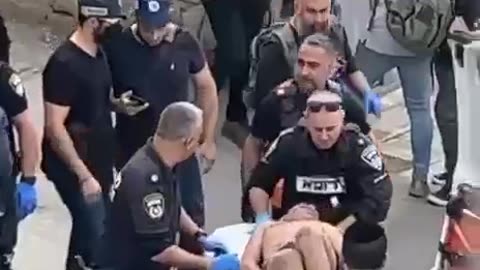 A 13 year old Jihadi Youth is treated by Israeli police after stabbing a pedestrian