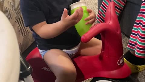 Little Boy Looks for His Water Cup