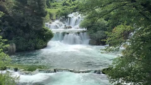 small waterfall turning into a river