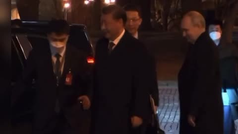 Vladimir Putin escorts Xi Jinping to the car as the first day of his three-day visit