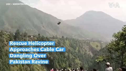 Rescue Helicopter Approaches Cable Car Dangling Over Pakistan Ravine| VOA News