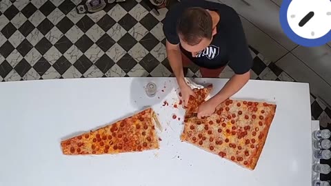 A slice of pizza At six feet, this is the world's largest slice of pizza