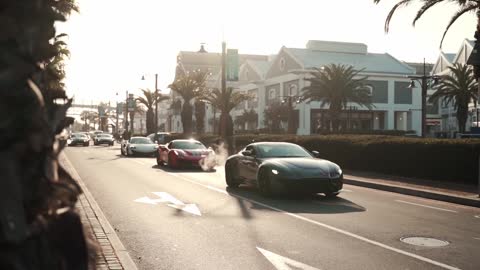 Group of Car Enthusiasts Driving on the Streets