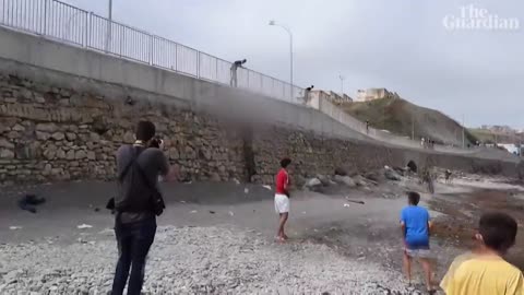 Migrant boy swims to beach in Spain's Ceuta with plastic bottles to stay afloat