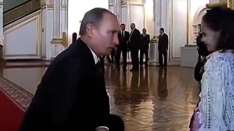 Putin kneels and treats the little girl with respect