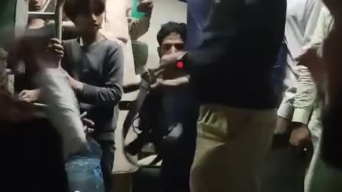 Guard beating a lady on a train