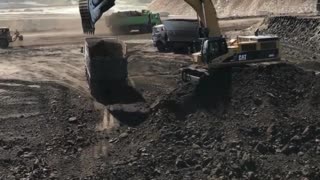 How many minutes does it take to load a truck with a Liebherr excavator