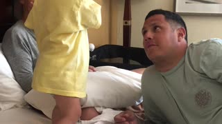 Surprised Toddler Throws Phone into Dad's Face