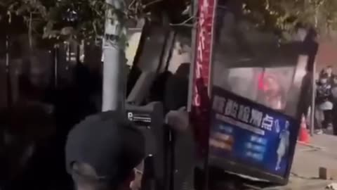 People in Lanzhou, China are waking up destroying Covid test booth