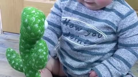 Cute Babies Playing with Dancing CactusHilarious shorts shortvideo funnybaby
