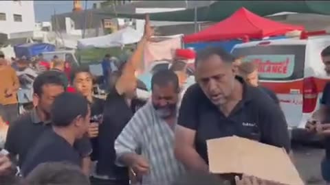 Palestinian father distributes sweets in Gaza, Palestine