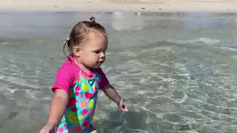 Funny Naomi is walking in the ocean, funny baby video