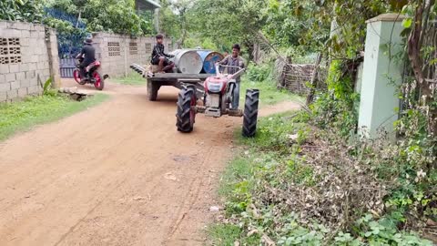 #79-driver tractor go transport water at the river