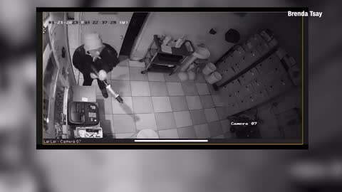 Surveillance footage shows hero confronting suspected gunman