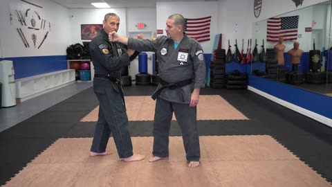 Correcting common errors executing the American Kenpo technique Kneel of Compulsion