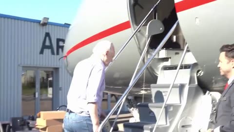 Julian Assange boards plane after being released from prison