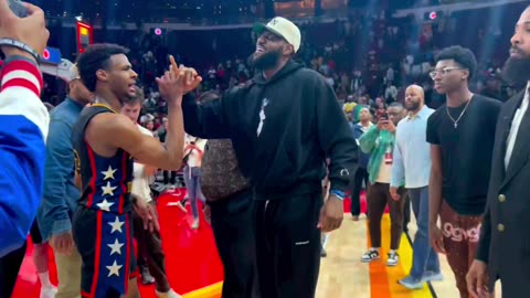 LeBron James and son bronny handshake after McDonald’s all American game