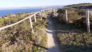 Hiking in the footpath along the coast