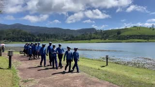 Sri Lankan schoolchildren walking by Gregory Lake, Nuwara Eliya, Sri Lanka