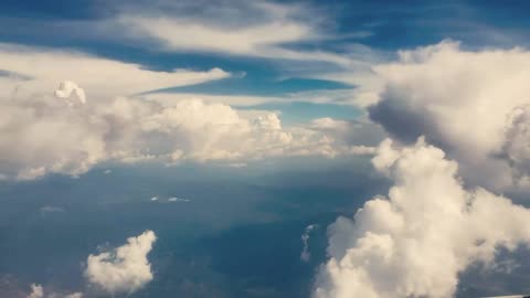 Blue sky with white clouds throbbing in the wind