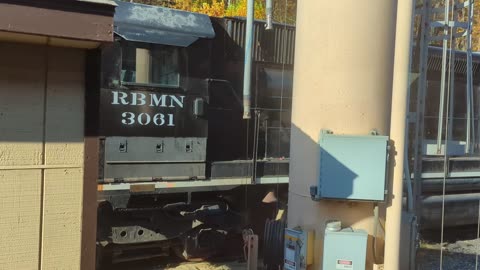 passing by RBM&N trains sitting in a yard