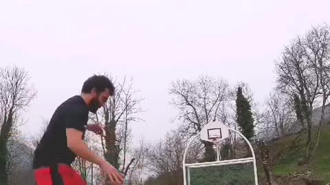 Man Makes Impressive Basketball Shot While Performing Karate Moves