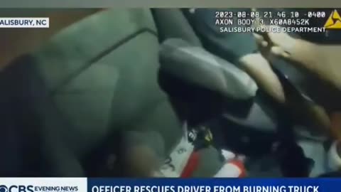 Police officer hailed a hero after rescue of driver from burning truck captured on camera #shorts