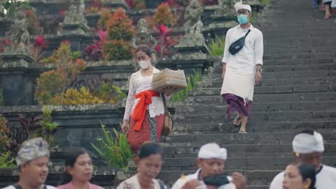 Tracking Shot of Woman Walking Down Steps In Bali