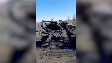 Ukrainian Soldier Shows Off Remains Of Destroyed Russian Battle Tank