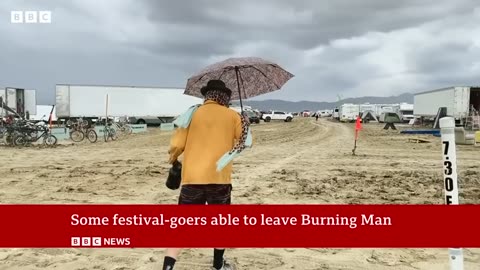Burning Man: Festival revellers remain stranded after torrential rains - BBC News