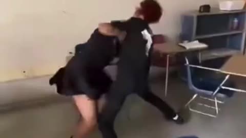 two girls start fighting ina classroom cs the girl ina black skirt was talkin shi.