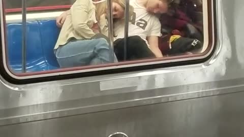 Two girls passed out on man on subway