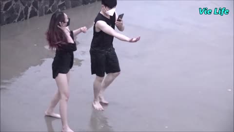 Beautiful Girl in Swimsuit Making Tiktok Video on The Beach