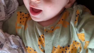 Contagious giggling baby being tickled