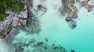 Swimming in Crystal water Drone Aerial View