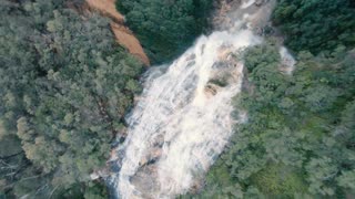 FPV Drone Zooms through Waterfall Dive