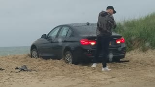 Guy Locked out of Car That's Still in Gear Stuck on the Beach