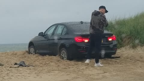 Guy Locked out of Car That's Still in Gear Stuck on the Beach