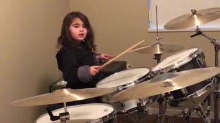 Little Girl Plays The Drums