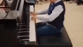 Child prodigy plays Mozart.