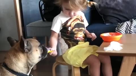 Charming Little Girl Shares Yummy Breakfast With Her Doggy