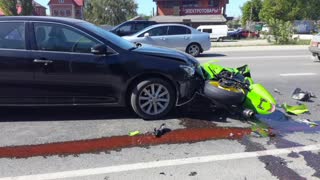 Motorcycle Hits Car Head on to Avoid Pedestrians
