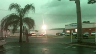 Lightning Strike Hits Light Pole Across Parking Lot