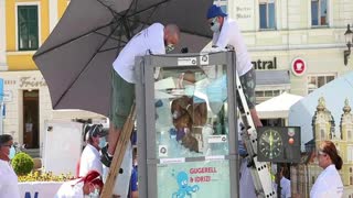 Austrian man breaks record for standing in box of ice