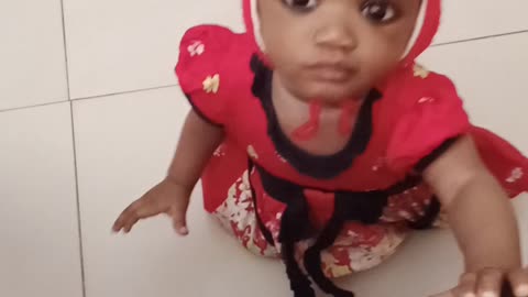 Baby trying to stand up on her own.