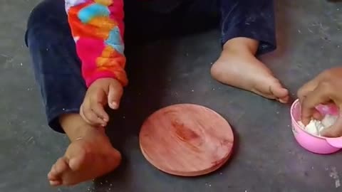 A little children make a bread.